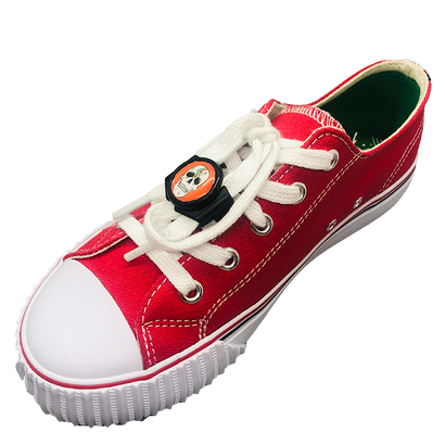 Single red shoe with black knotbots shoelace lock keeping the shoe tied