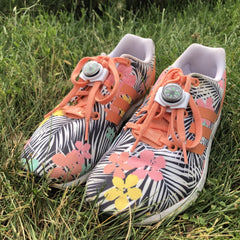 pair of shoes in grass with knotbot shoelace locks keeping shoes tied