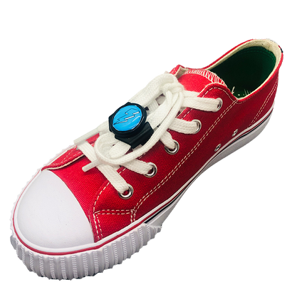 knotbots shoelace lock on white shoe keeping shoelace tied