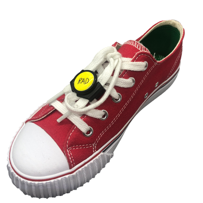 Single red shoe with black knotbots shoelace lock keeping the shoe tied