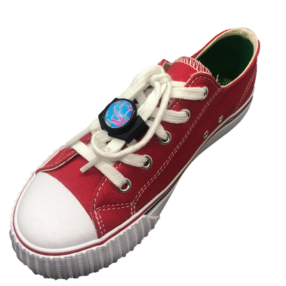 Single red shoe with black knotbots shoelace lock keeping the shoe tied