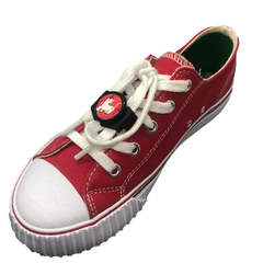 Single red shoe with black knotbots shoelace lock keeping the shoe tied